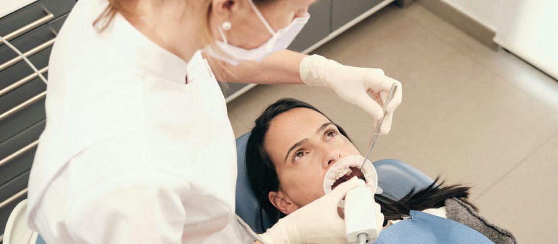 Patient receiving a dental check-up, emphasizing the importance of regular dental visits for preventive care and optimal oral health, for Wells Family Dental's blog